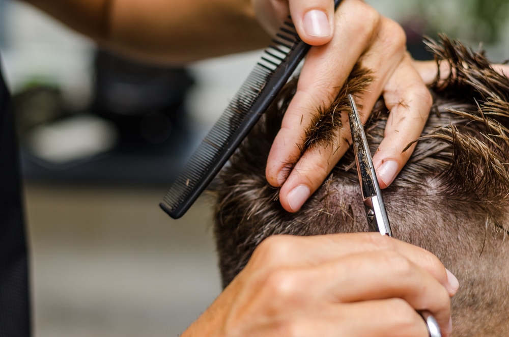 photo of hairdresser cutting hair
